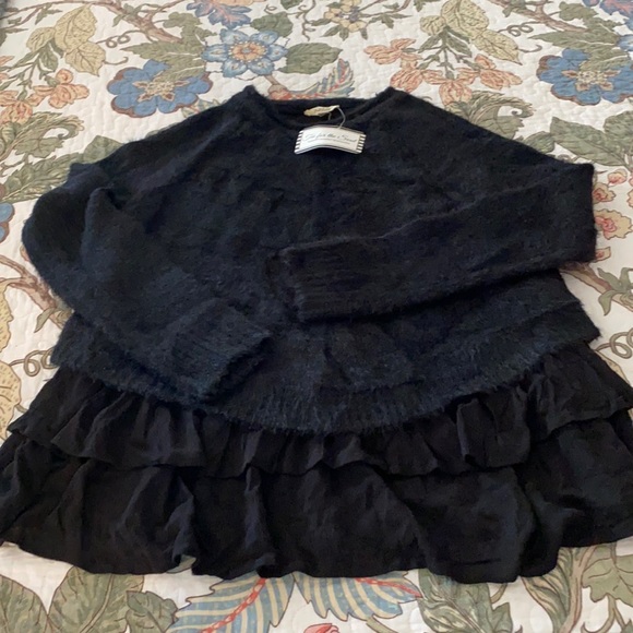 Ruffled bottom black sweater. - Picture 1 of 3